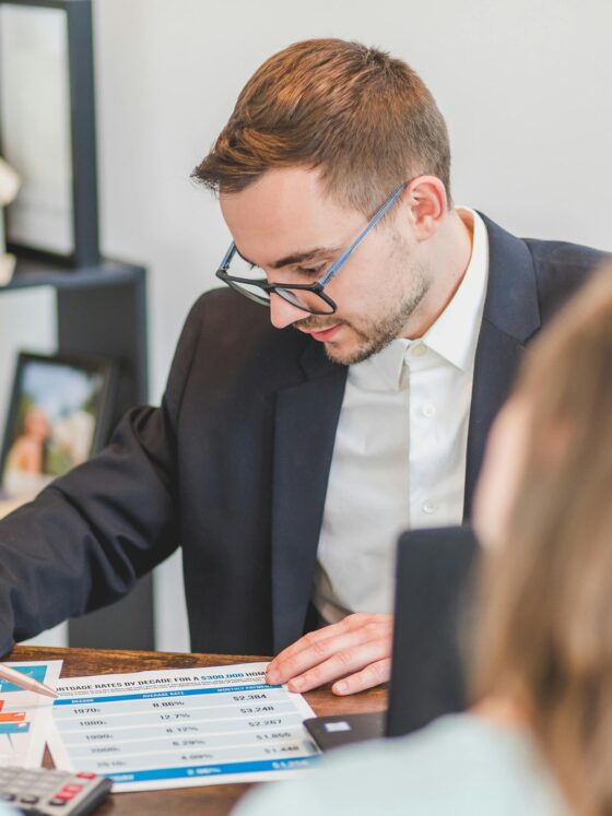 Debt Consolidation Loan: Couple speaking to a financial advisor