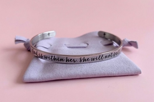 Easter Basket: Stainless steel bracelet with "God Is Within Her" etched on it