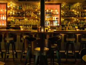 Speakeasy: Dark, moody bar with bar stools