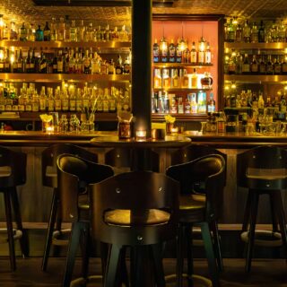 Speakeasy: Dark, moody bar with bar stools