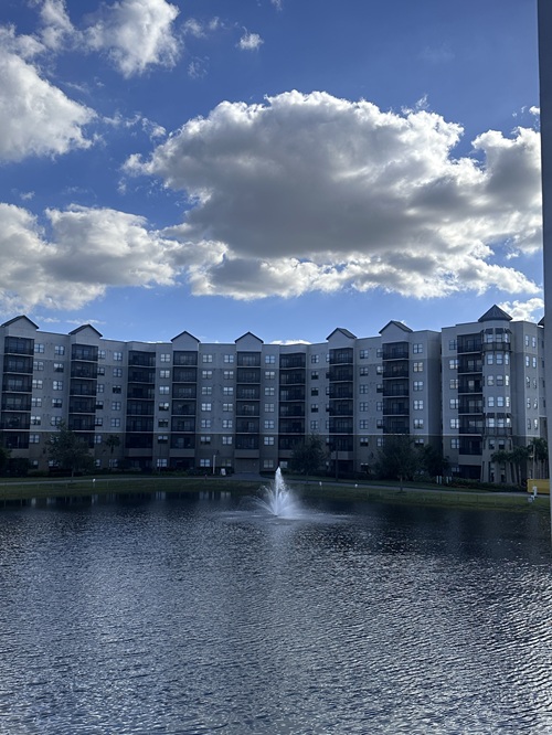 The Terraces at the Grove Resort: View of pond with fountain looking at a hotel tower across the way