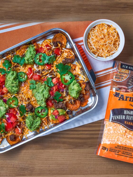 High-Protein Cheese: Casserole next to a package of shredded Armstrong Cheddar Cheese