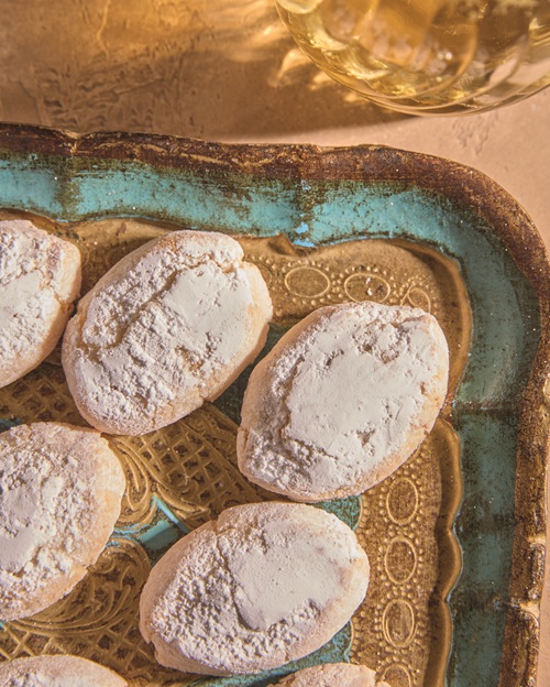 Italian Cookies: Ricciarelli Almond Cookies on a scalloped gold and tuquoise plate