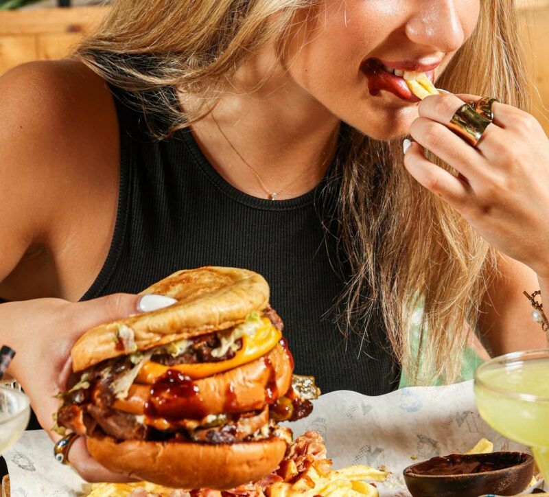 Burger: Girl eating a burger, retro diner, juicy burger, sandwiches and handhelds, fries, take-out, fast food
