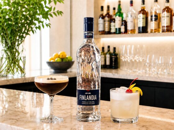 Cocktail Culture: Finlandia Vodka Bottle with a cocktail on either side on a bar
