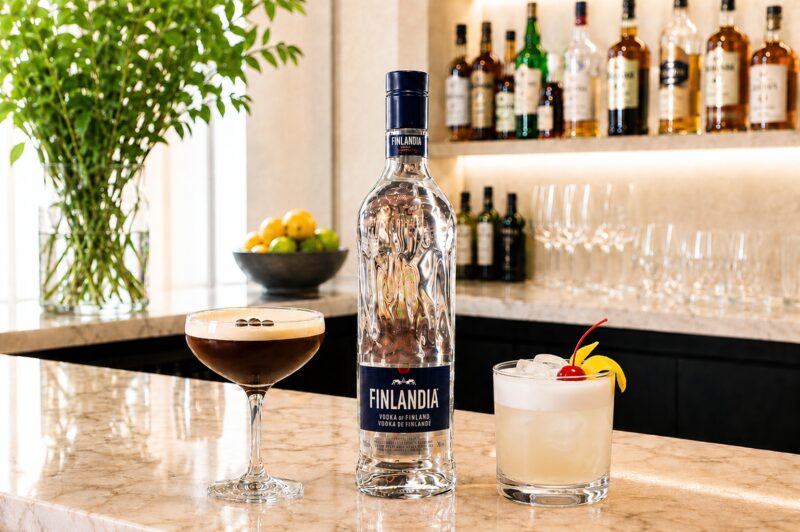 Cocktail Culture: Finlandia Vodka Bottle with a cocktail on either side on a bar