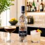 Cocktail Culture: Finlandia Vodka Bottle with a cocktail on either side on a bar