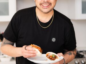 CookUnity: Chef Trevor Lui holding a bao