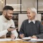 Tutors in Toronto: Two friends laughing as they are studying together