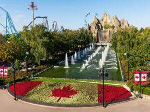 Canada's Wonderland: Wonder Mountain with topiary Canadian flag in the foreground and roller coasters in the background