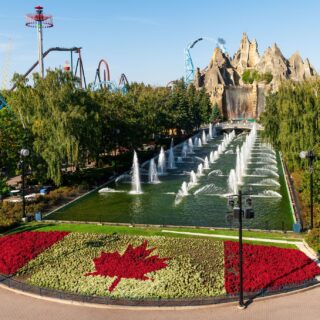 Canada's Wonderland: Wonder Mountain with topiary Canadian flag in the foreground and roller coasters in the background