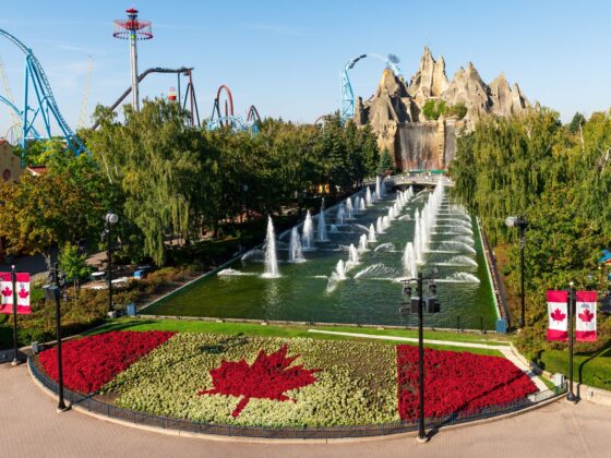 Canada's Wonderland: Wonder Mountain with topiary Canadian flag in the foreground and roller coasters in the background