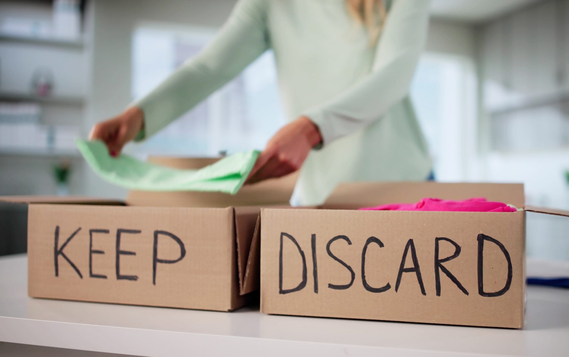 Decluttering: Organized Woman Sorting Through Wardrobe, Decluttering Clothes For Donation