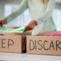 Decluttering: Organized Woman Sorting Through Wardrobe, Decluttering Clothes For Donation