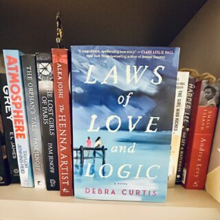 Laws of Love and Logic: Book facing forward on a book shelf with other books