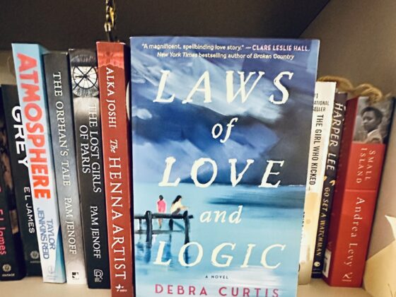 Laws of Love and Logic: Book facing forward on a book shelf with other books