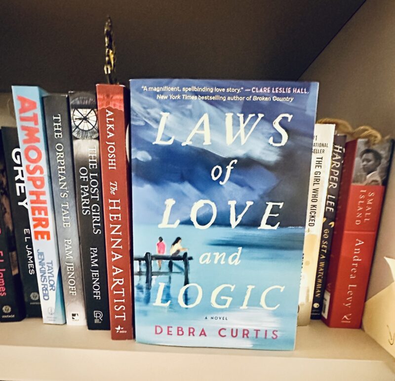 Laws of Love and Logic: Book facing forward on a book shelf with other books