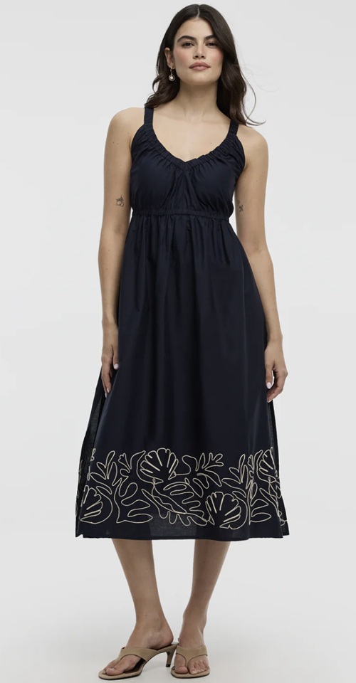 Favourite Canadian Brands: Woman in a navy blue sundress with an embroidered bottom