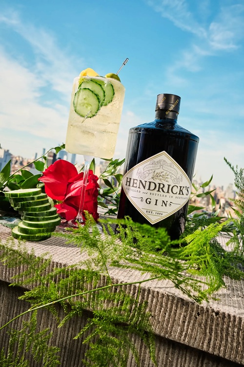 Hendrick's: Hendrick's Black Gin next to cocktail and roses