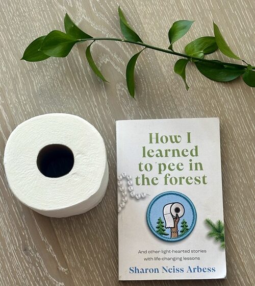 How I Learned to Pee in the Forest : Book with a roll of toilet paper and stem of a green plant