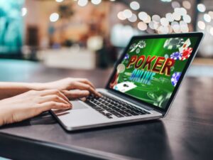 Online Casino Market: Close up cropped photo of girl hands using her laptop for playing poker online.