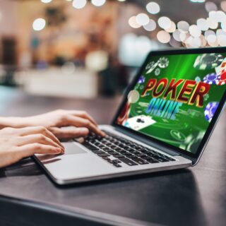 Online Casino Market: Close up cropped photo of girl hands using her laptop for playing poker online.