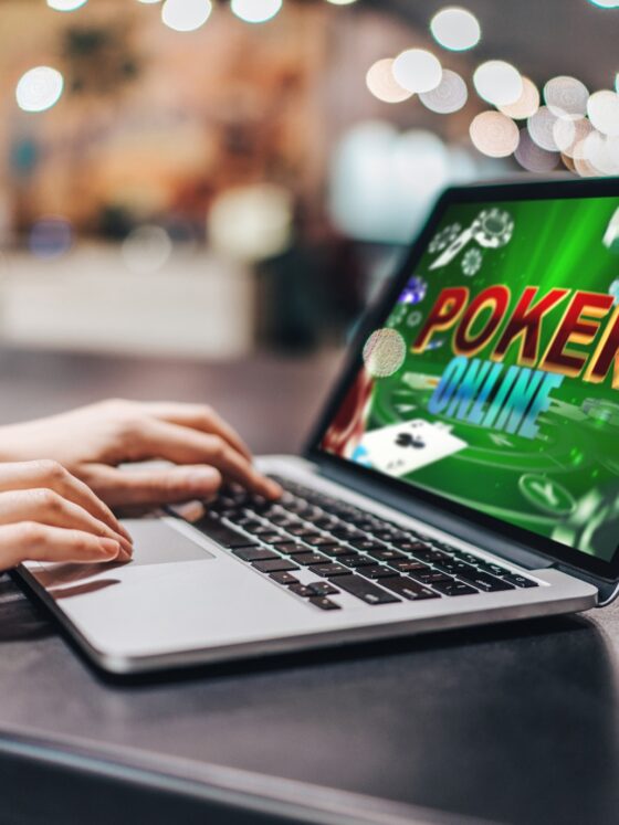 Online Casino Market: Close up cropped photo of girl hands using her laptop for playing poker online.