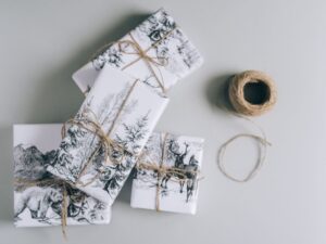 Gifts for your Mother-In-Law: Three wrapped gifts with winter scenes and twine