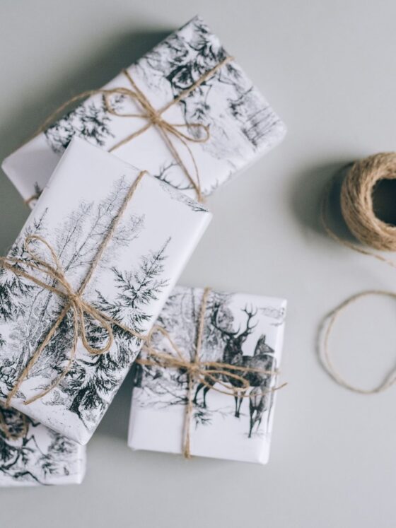 Gifts for your Mother-In-Law: Three wrapped gifts with winter scenes and twine