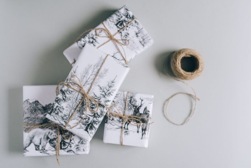 Gifts for your Mother-In-Law: Three wrapped gifts with winter scenes and twine