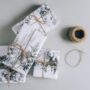 Gifts for your Mother-In-Law: Three wrapped gifts with winter scenes and twine