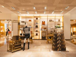 Savoir-Faire Toronto: Wide shot of the entrance of the Louis Vuitton Store in Yorkville with trunks visible
