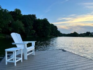 RTDs: White Muskoka Chair and table by lake