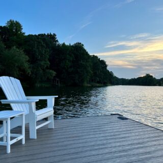 RTDs: White Muskoka Chair and table by lake