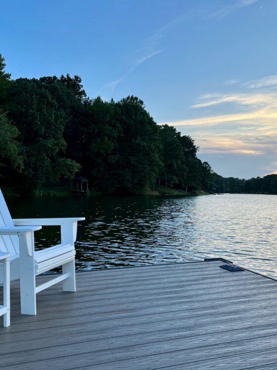 RTDs: White Muskoka Chair and table by lake