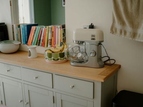 Gifts for your Mother-In-Law: stand mixer near cookbooks on a kitchen counter
