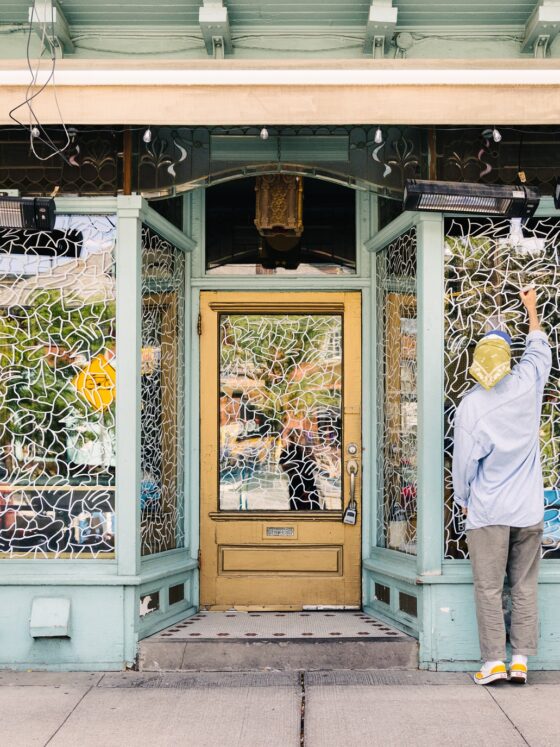 The Window Project: Artist Lucas Beaufort drawing on DaiLo's window