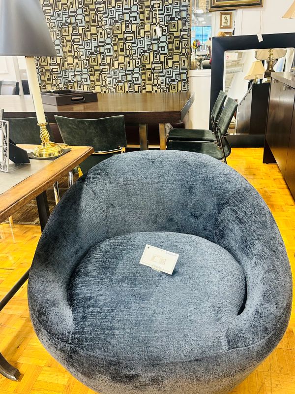 Shop Consignment: Gray circular plush chair with price tag