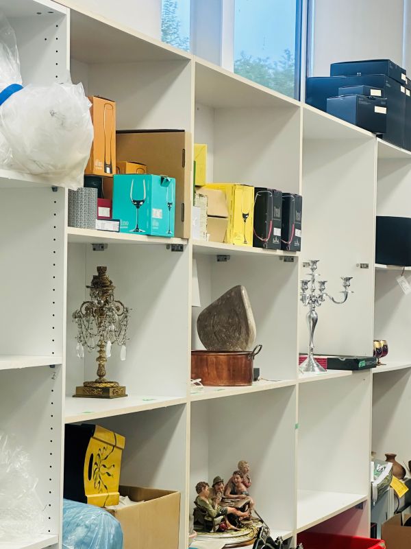 Consigning Your Furniture: Small decor items on white shelves