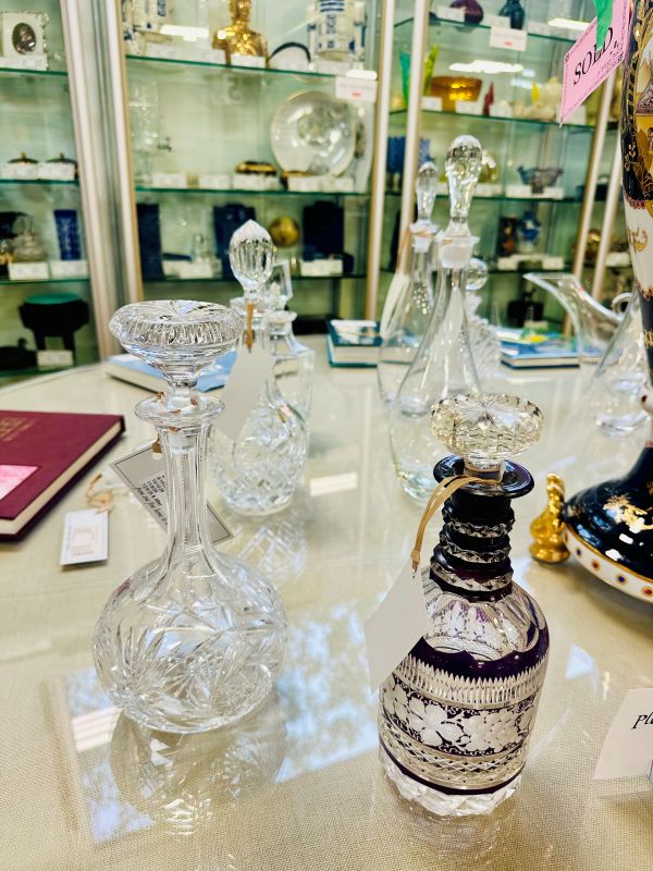Shop Consignment: Crystal decanters displayed on a retail table